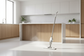 Cordless spray mop on kitchen floor